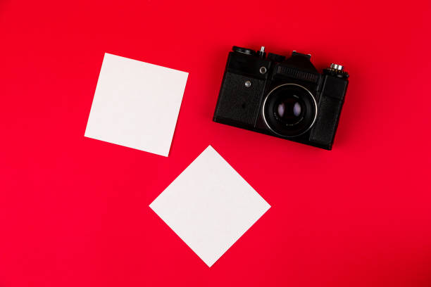 istock Flat lay film camera isolated on red background. Copy space 1210546508