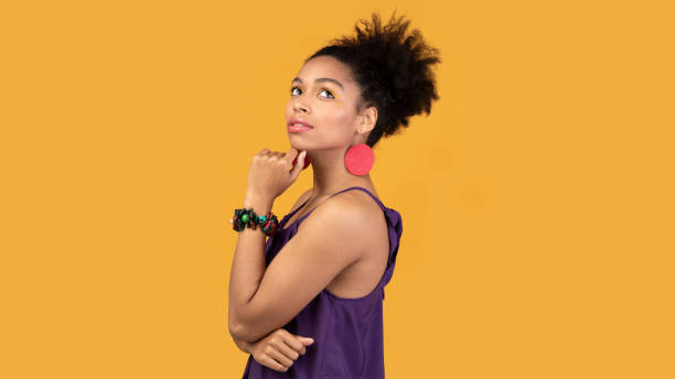 istock Pensive black woman thinking about something at studio 1210547989