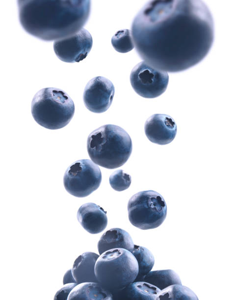 istock Ripe blueberries levitate on a white background 1210548391