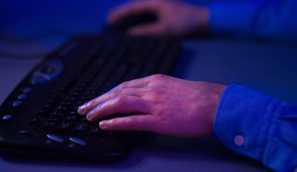 istock Male Hands On Computer Keyboard, Playing Online Game Indoor 1210548474