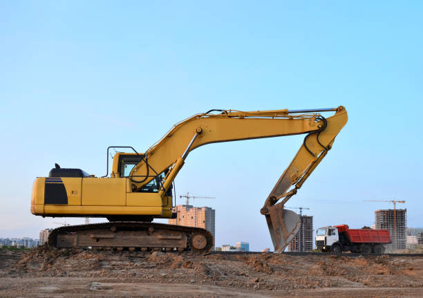 istock Tracked excavator working at a construction site during laying or replacement of underground storm sewer pipes. Installation of water main, sanitary sewer, storm drain systemsduring - Image 1210549940