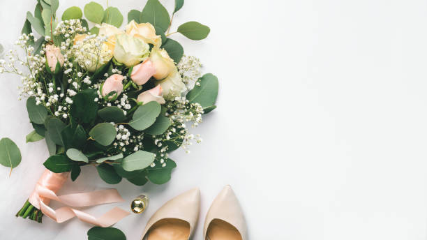 istock Bride accessories with bouquet and high heel shoes 1210550143