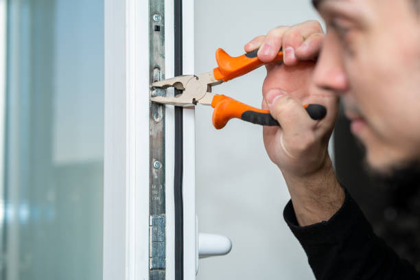 istock Professional master for repair and installation of windows, sets up a window opening system in winter mode 1210550883