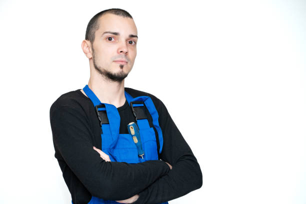 istock Professional repair, installation and maintenance technician. In a work suit 1210551173