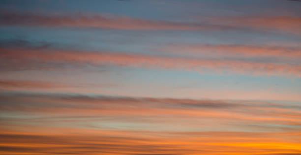 istock Fiery orange sunset. Beautiful clouds against the darkening sky 1210551211