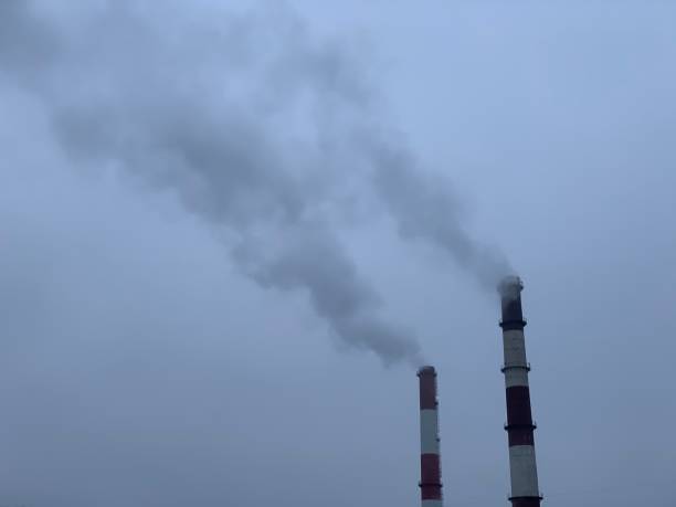 istock Smoking chimneys of factories 1210551215