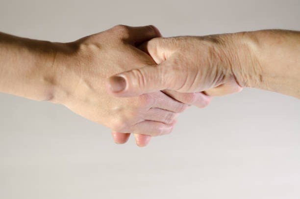 istock Man and woman shake hands. Gender equality 1210551220