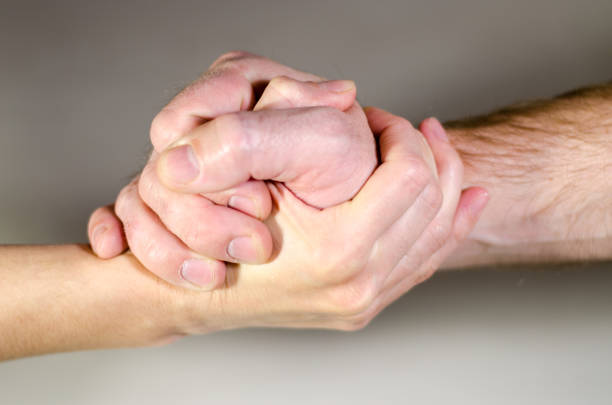 istock Man and woman shake hands. Gender equality 1210551223