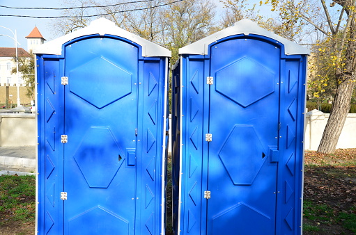 Two blue street toilets