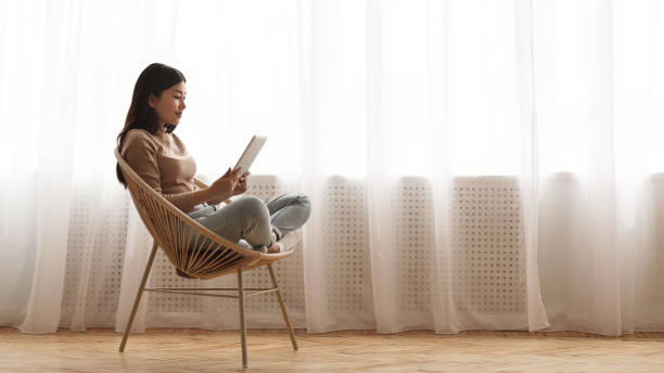 istock Morning vibes. Girl reading e-book on tablet 1210551324