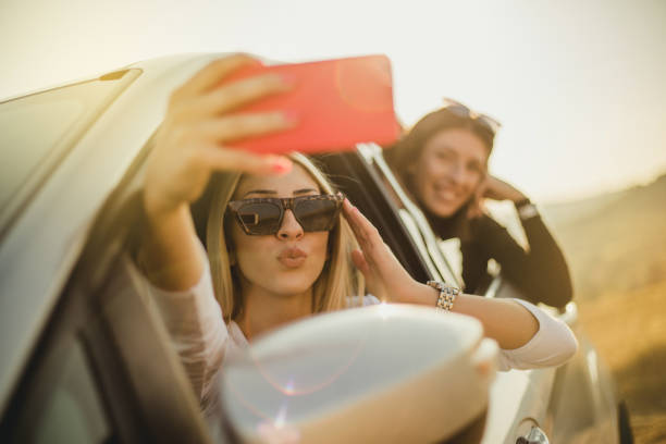 istock Two women are enjoying a car ride 1210551962