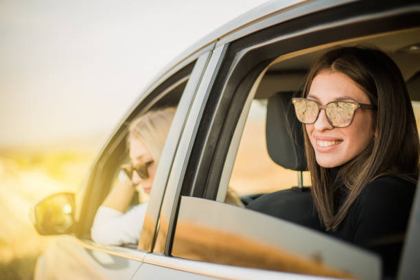 istock Two women are enjoying a car ride 1210552583