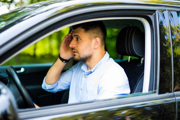 istock Stressed young handsome driver man in his car 1210556973