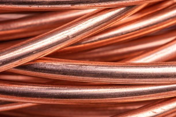 Shiny roll of copper wire Shiny roll of copper wire close-up copper cable stock pictures, royalty-free photos & images