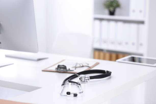istock Stethoscope, prescription medical form lying on a table with pc computer. Medicine or pharmacy concept. Medical tools at doctor working table 1210557094