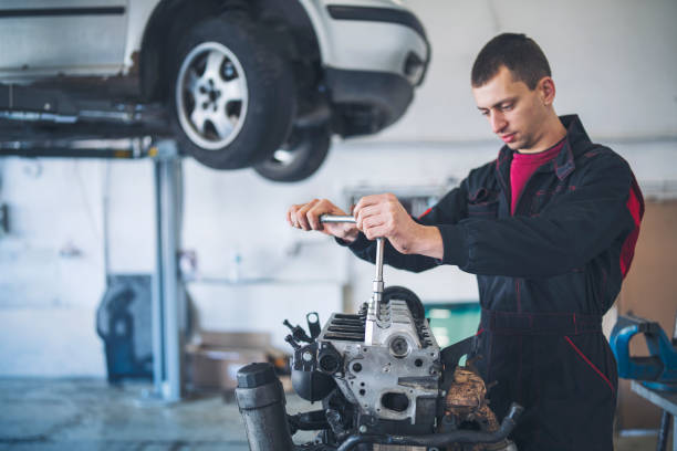 istock Male Mechanic Repairing Car Engine At Garage 1210558609