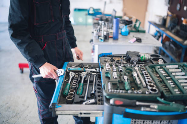 istock Unrecognisable Mechanic Holding Ratchet Chooses Other Tool 1210558611