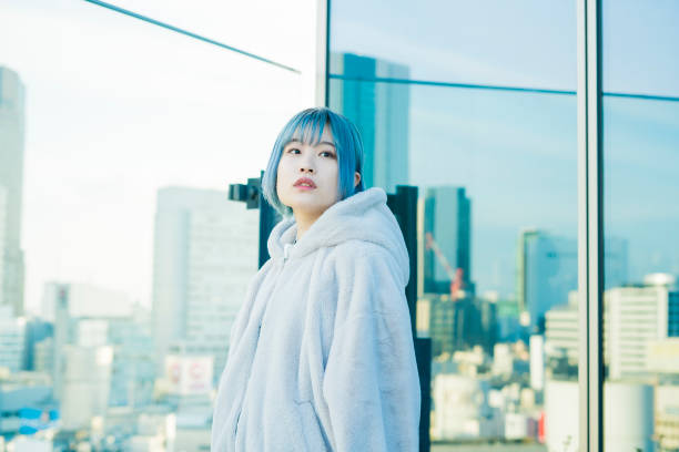 istock Young woman with blue hair 1210561063