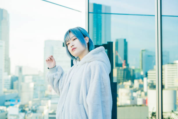istock Young woman with blue hair 1210561094