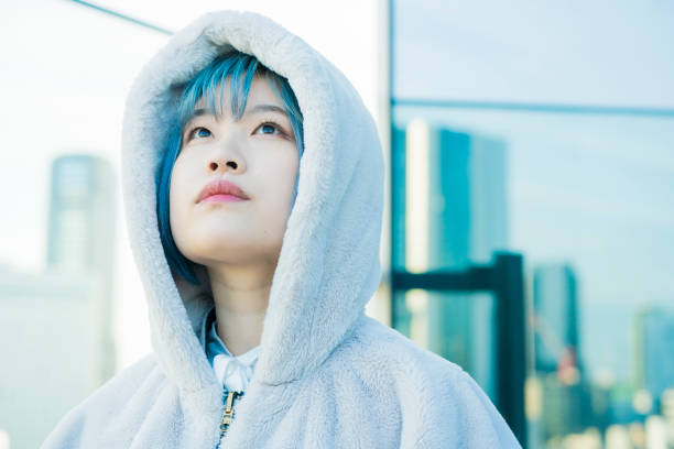 istock Young woman with blue hair 1210561134