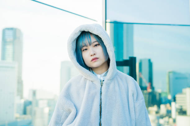 istock Young woman with blue hair 1210561149