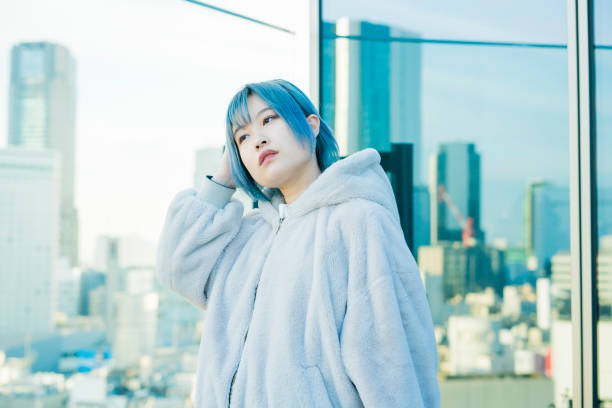 istock Young woman with blue hair 1210561159