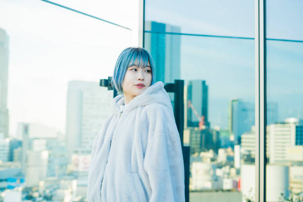 istock Young woman with blue hair 1210561167
