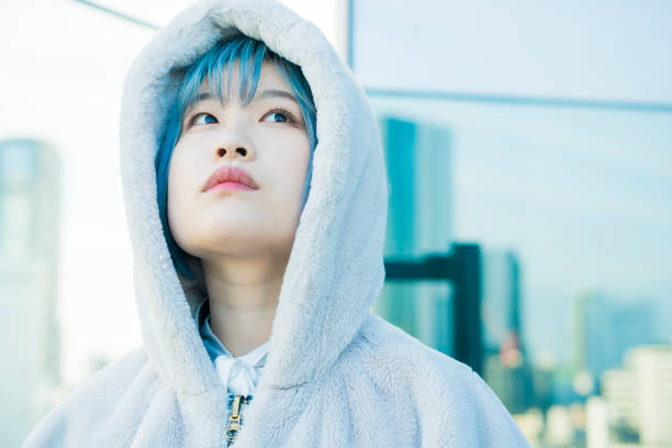 istock Young woman with blue hair 1210561179
