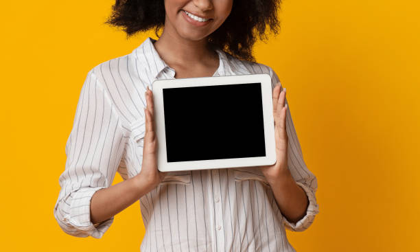 istock Digital Tablet With Black Screen In Hands Of Unrecognizable Afro Lady 1210561283