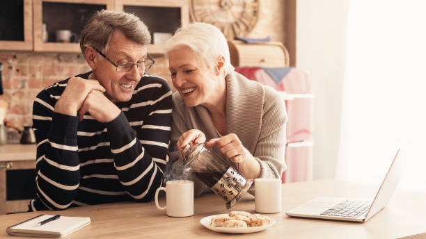 istock Happy Aged Couple Drinking Coffee, Relaxing Together In Kitchen 1210561705