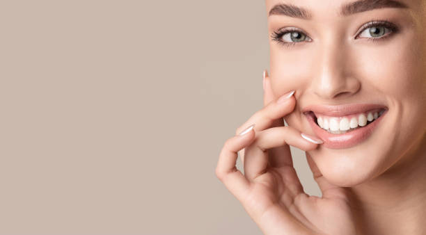 istock Attractive Girl Smiling Touching Lips Posing In Studio, Panorama 1210561750