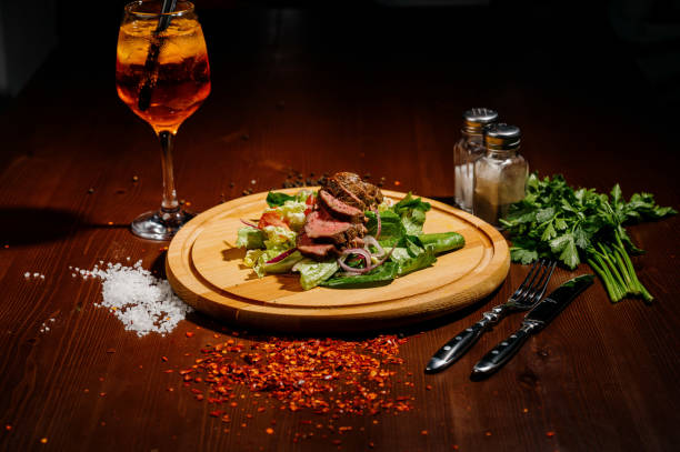istock ham with lettuce on a wooden board on a table 1210562395