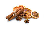 Aromatherapy: dried citrus slices, cinnamon and star anise isolated on white background