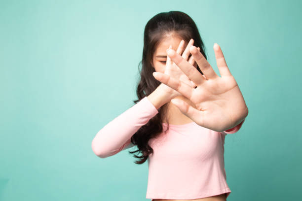istock Young Asian woman hide her  face. 1210565610