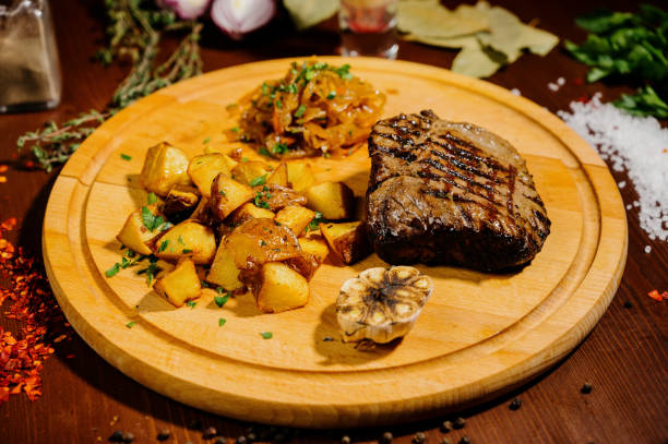 istock fried potatoes on a plate on a wooden table 1210566395