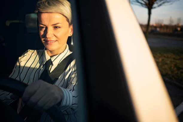 istock Smiling woman in a car 1210567191