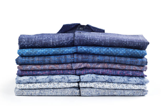 istock Stack of men's shirts isolated on white background 1210567960