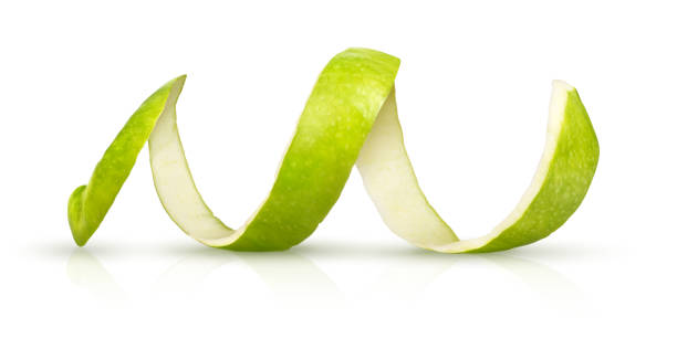 Peeling green apple on a white background