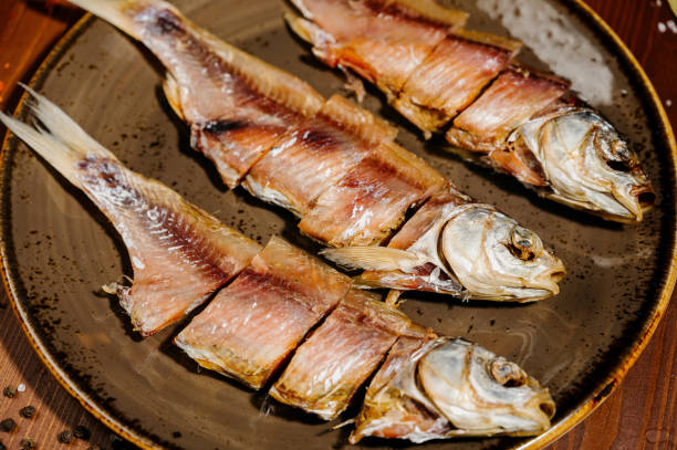 istock Group of dried fish at plate . Seafood 1210568730