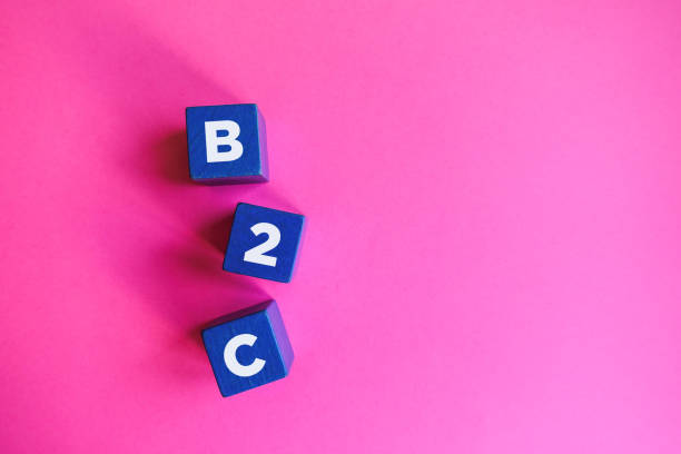 istock B2C - Business to Consumer, blue cubes on pink background. 1210569012