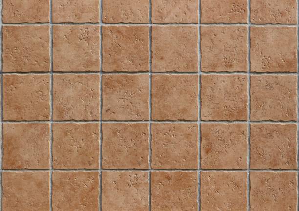 istock Terracotta rustic tiles with uneven edges, used both as wall cladding or flooring 1210569374