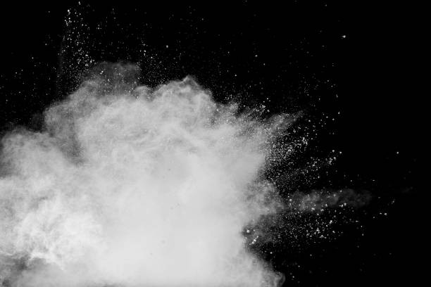 istock White talcume powder explosion on black background. White dust particles splash. 1210569464