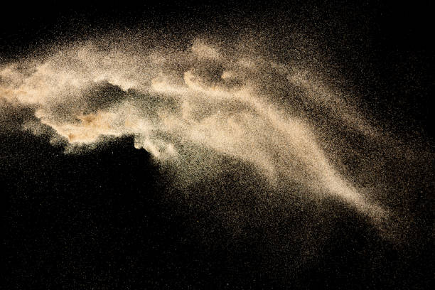 istock Brown colored sand splash.Dry river sand explosion isolated on black background. Abstract sand cloud. 1210569558