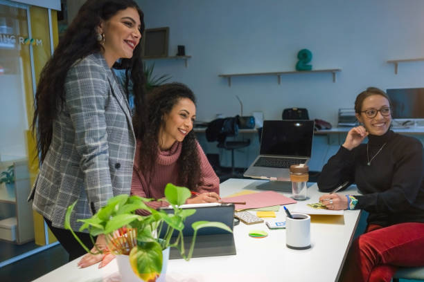 istock New business startup: all women team work together in coworking office 1210569563