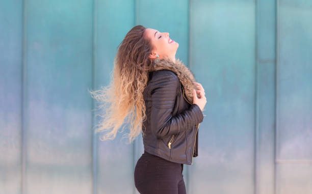istock Young woman over the light blue background 1210570818