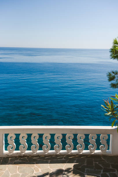 istock White fence over sea 1210573611