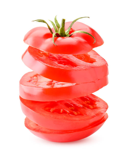 istock Ripe tomato cut into pieces flies on a white background.Isolated 1210573884