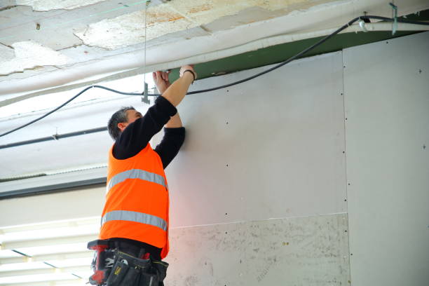 istock Plaster applying plaster on a new drywall installation. 1210574850