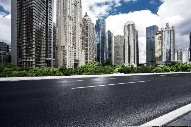 istock Asphalt road High way Empty curved road clouds and sky at sunset 1210575241
