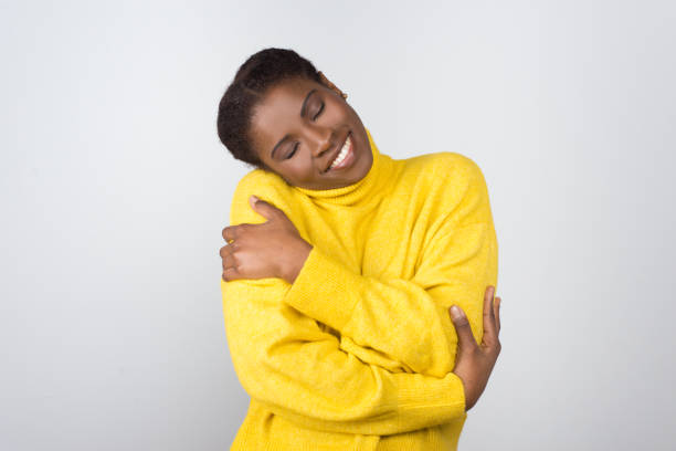 istock Cheerful young woman with closed eyes 1210575610